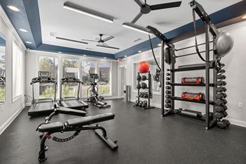 24-Hour fitness center with peloton bikes and echelon mirror